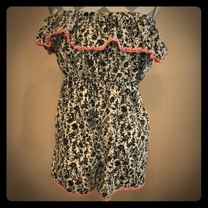 Black and white Jolt romper with pink trim